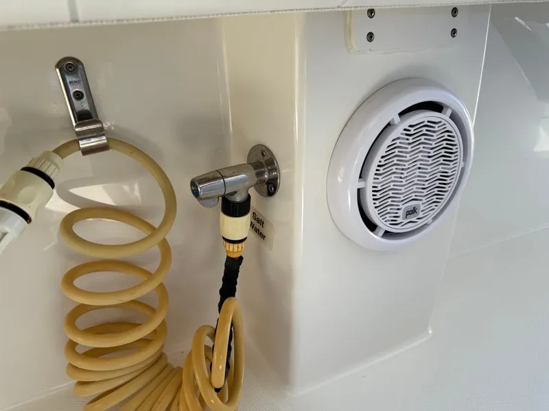 Slide: The Image of 2019 Regulator 31 boat deck with coiled hose and speaker. - 20