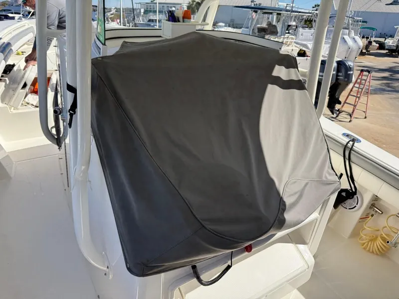 Slide: The Image of 2019 Regulator 31 boat console covered with a protective gray tarp. - 22