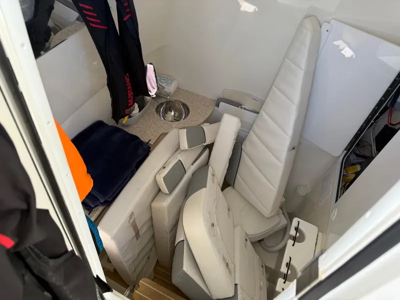 Slide: The Image of Interior of a 2019 Regulator 31 boat with folded seats and storage area. - 23