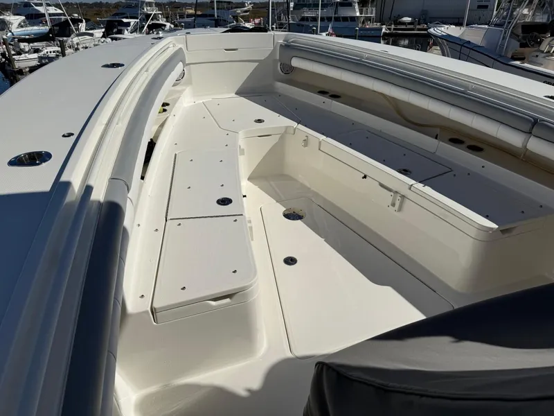 Slide: The Image of 2019 Regulator 31 boat interior with spacious seating and storage compartments. - 25