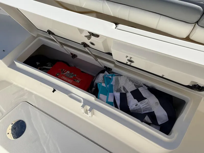 Slide: The Image of Storage compartment on a 2019 Regulator 31 boat with gear and equipment. - 27