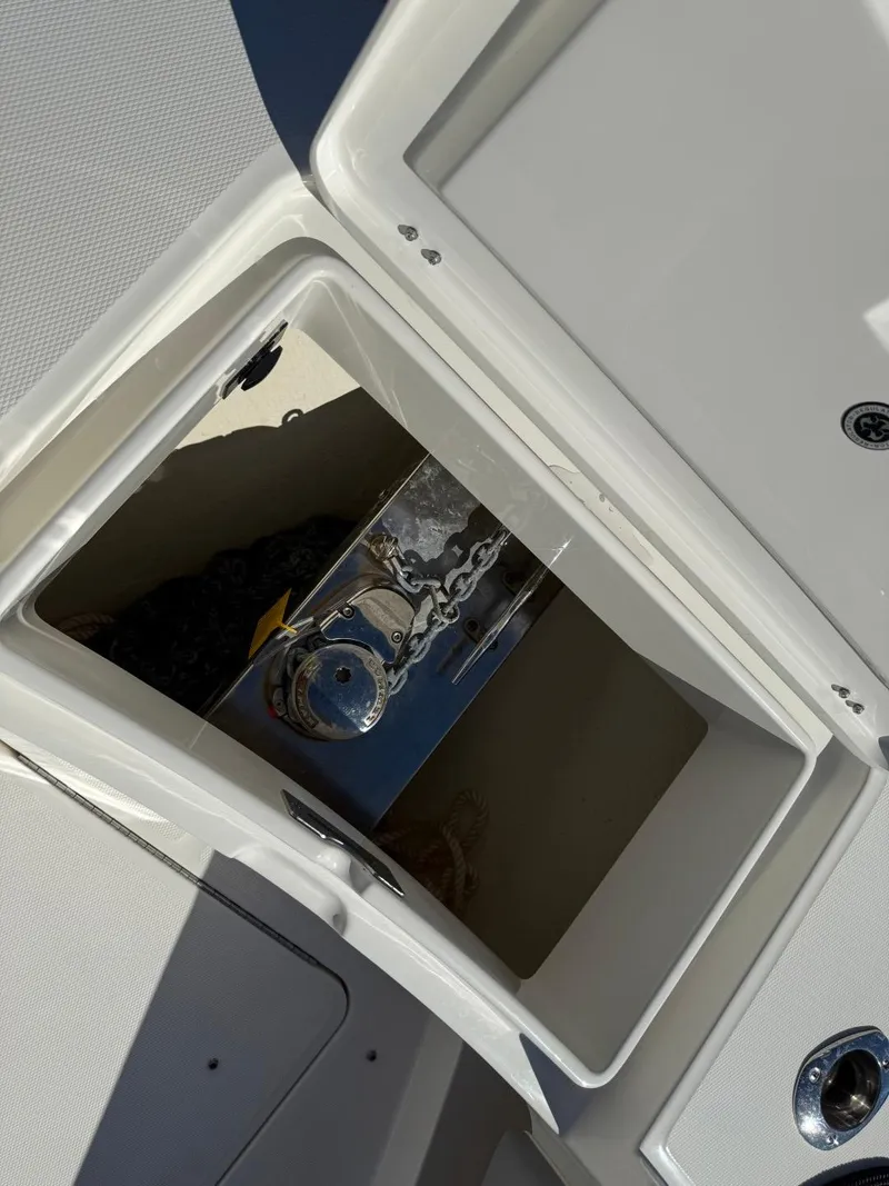Slide: The Image of 2019 Regulator 31 boat anchor compartment with chain storage. - 29