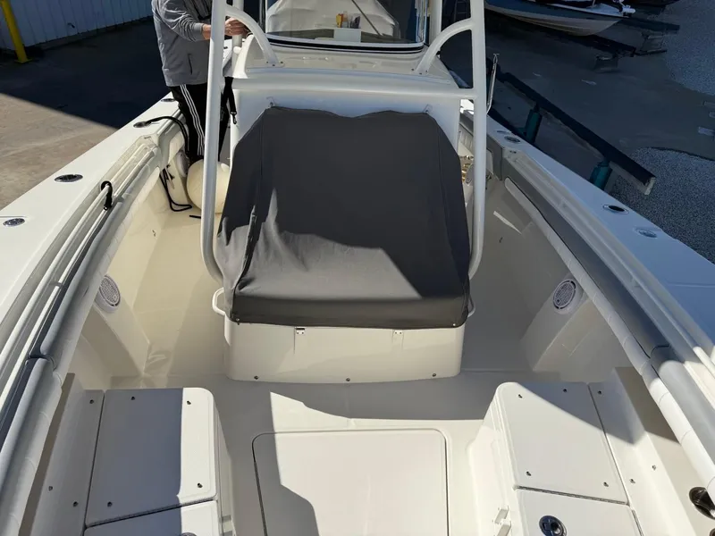 Slide: The Image of 2019 Regulator 31 boat interior with seating and console, viewed from the bow. - 30