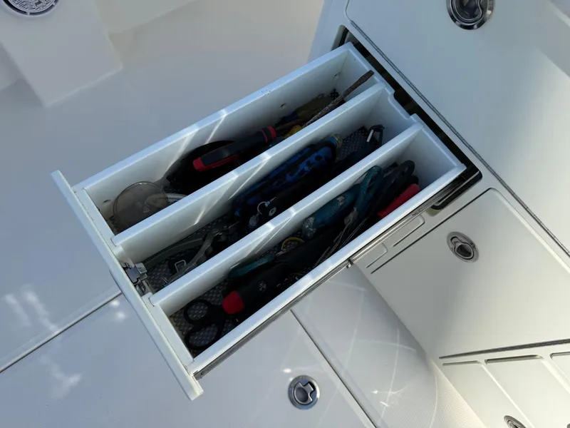 Slide: The Image of Open drawer with tools on a 2019 Regulator 31 boat. - 36