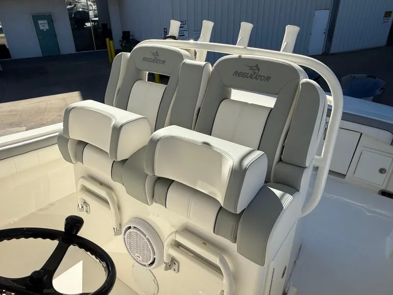 Slide: The Image of 2019 Regulator 31 boat seats with steering wheel and speaker. - 41