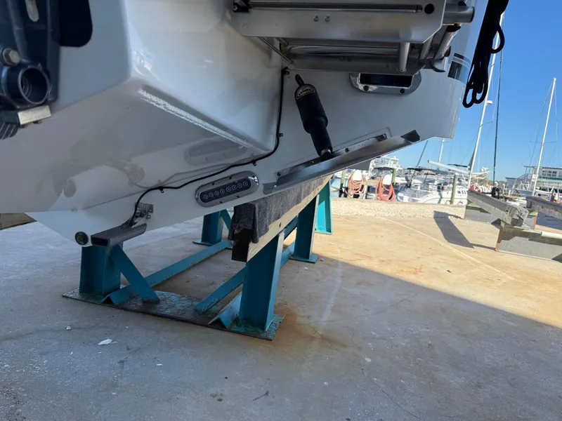 Slide: The Image of 2019 Regulator 31 boat on stands at a marina, showing hull and equipment. - 5
