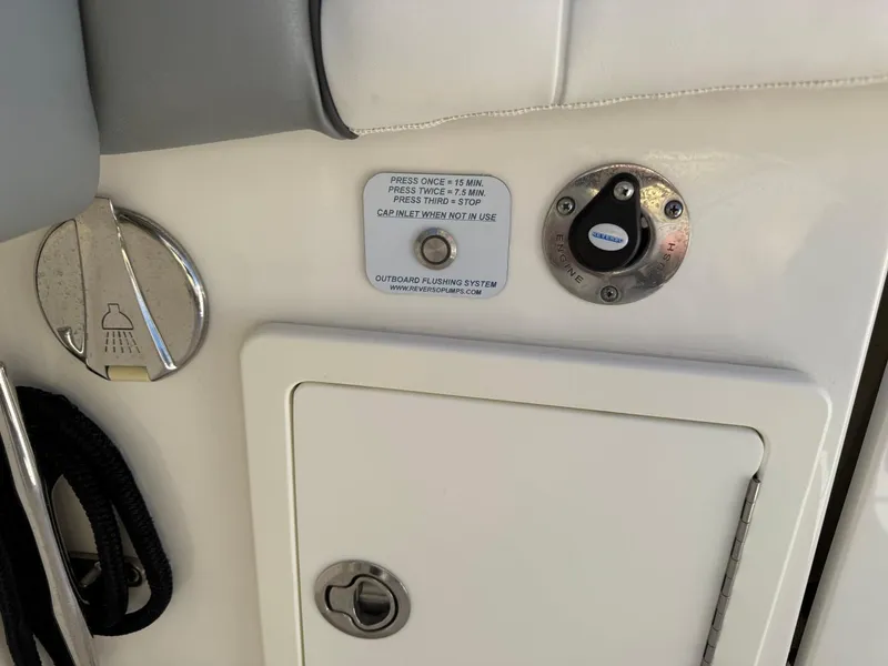 Slide: The Image of 2019 Regulator 31 boat control panel with shower icon and access hatch. - 9