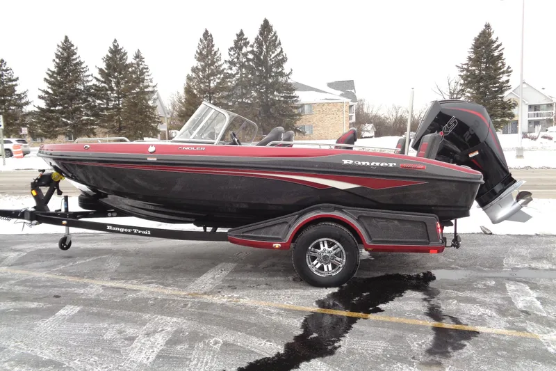 The Image of 2025 Ranger 1880 MS Angler boat on trailer, parked in snowy setting. - 0
