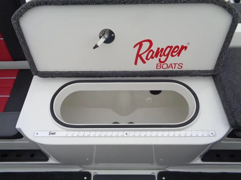 Slide: The Image of 2025 Ranger 1880 MS Angler boat storage compartment with measuring ruler and key lock. - 11