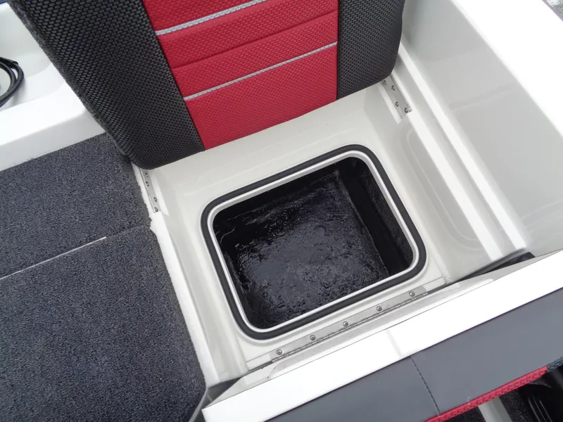 Slide: The Image of 2025 Ranger 1880 MS Angler boat interior with storage compartment and red seating. - 12