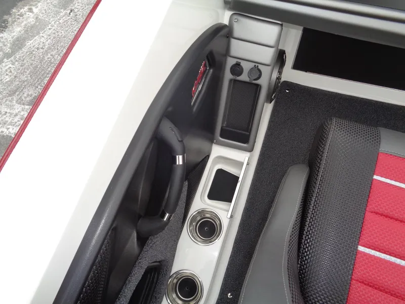 Slide: The Image of Interior of 2025 Ranger 1880 MS Angler boat with cup holders and red seat. - 14