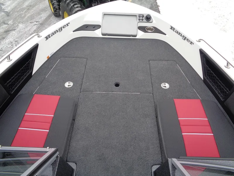 Slide: The Image of 2025 Ranger 1880 MS Angler boat deck with red and black seating, featuring a control panel. - 18