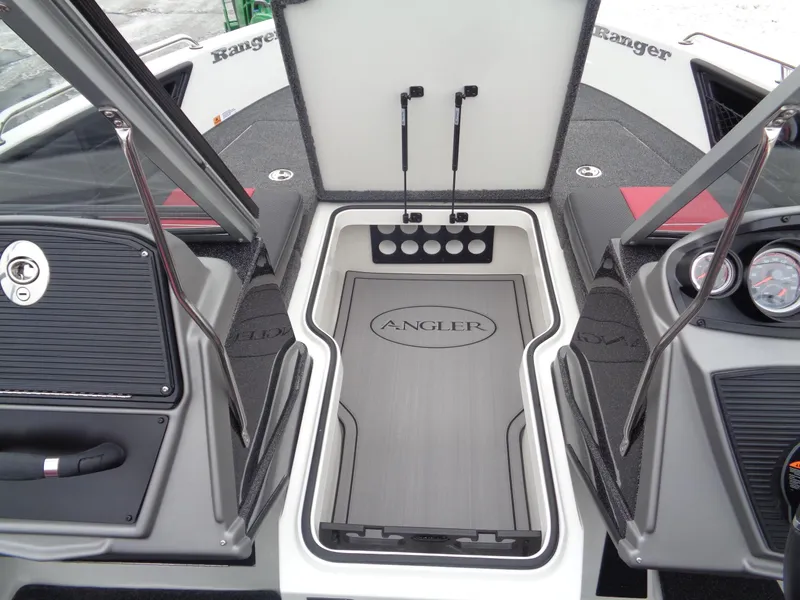 Slide: The Image of 2025 Ranger 1880 MS Angler boat interior with storage compartments and control panels. - 19