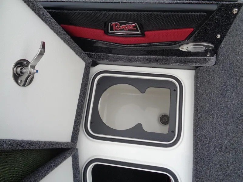 Slide: The Image of 2025 Ranger 1880 MS Angler boat storage compartments with open hatch and logo. - 24