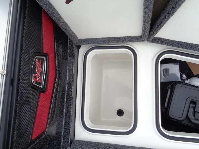 Slide: The Image of 2025 Ranger 1880 MS Angler storage compartments with red and black trim. - 26