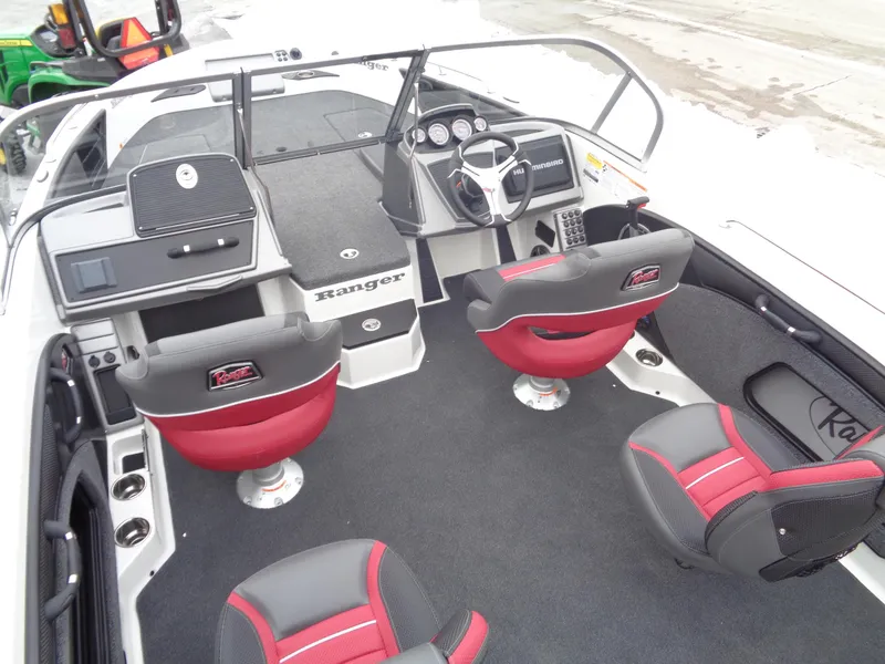 Slide: The Image of 2025 Ranger 1880 MS Angler boat interior with red and black seating, modern dashboard, and steering wheel. - 4
