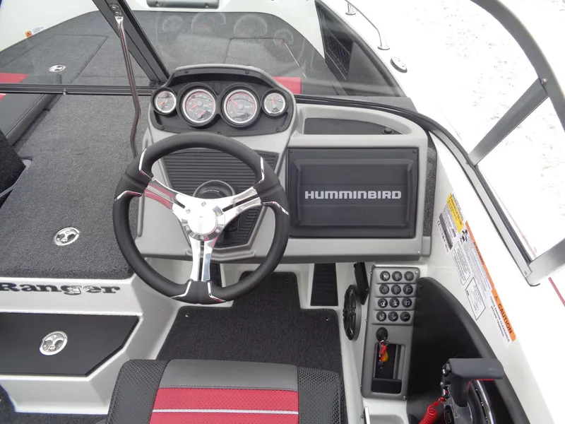 Slide: The Image of 2025 Ranger 1880 MS Angler boat dashboard with steering wheel and Humminbird display. - 6
