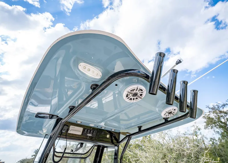 Slide: The Image of 2025 Sea Hunt Ultra 255 SE boat top view with rod holders and speakers. - 18