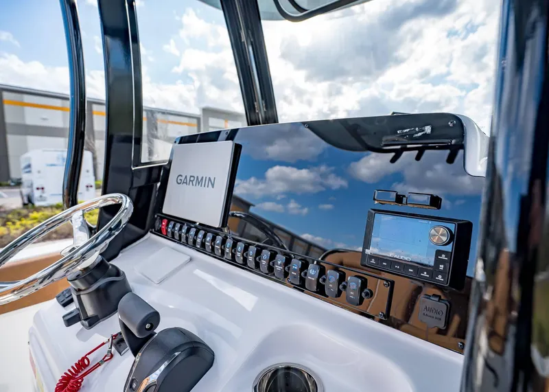 Slide: The Image of Dashboard of 2025 Sea Hunt Ultra 255 SE with Garmin navigation system. - 24