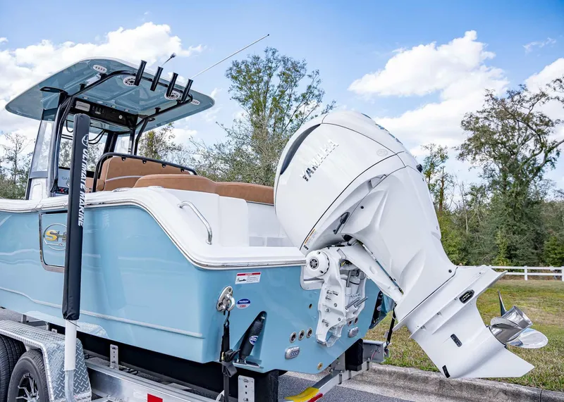 Slide: The Image of 2025 Sea Hunt Ultra 255 SE boat with Yamaha outboard engine on trailer. - 4