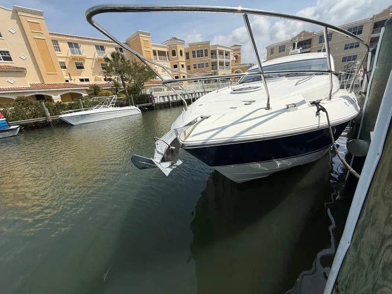 Slide: The Image of 2013 Fairline Targa 38 Open yacht docked in a marina, surrounded by buildings. - 11