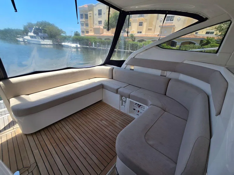 Slide: The Image of 2013 Fairline Targa 38 Open yacht interior with cushioned seating and wooden flooring. - 12