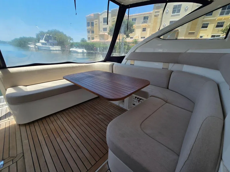 Slide: The Image of 2013 Fairline Targa 38 Open yacht interior with seating and wooden table. - 13