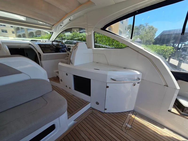 Slide: The Image of Interior of 2013 Fairline Targa 38 Open yacht, featuring sleek design and wooden flooring. - 16