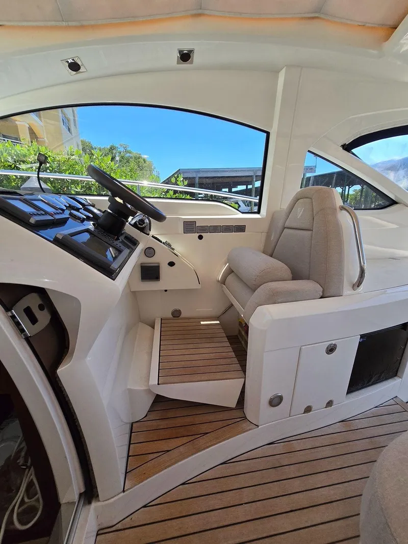 Slide: The Image of 2013 Fairline Targa 38 Open cockpit with modern controls and comfortable seating. - 17