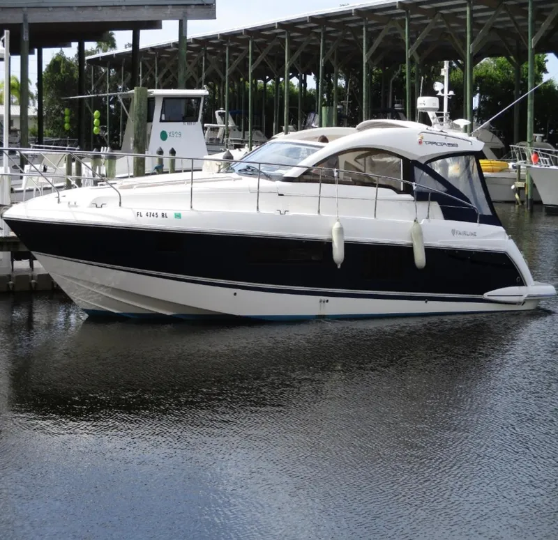 Slide: The Image of 2013 Fairline Targa 38 Open yacht docked in marina, side view. - 2