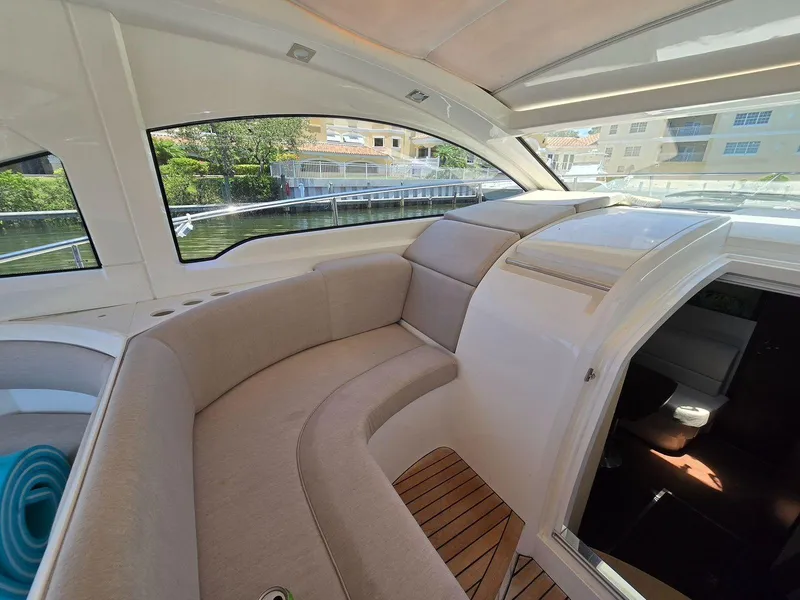 Slide: The Image of 2013 Fairline Targa 38 Open yacht interior with beige seating and wooden flooring. - 20