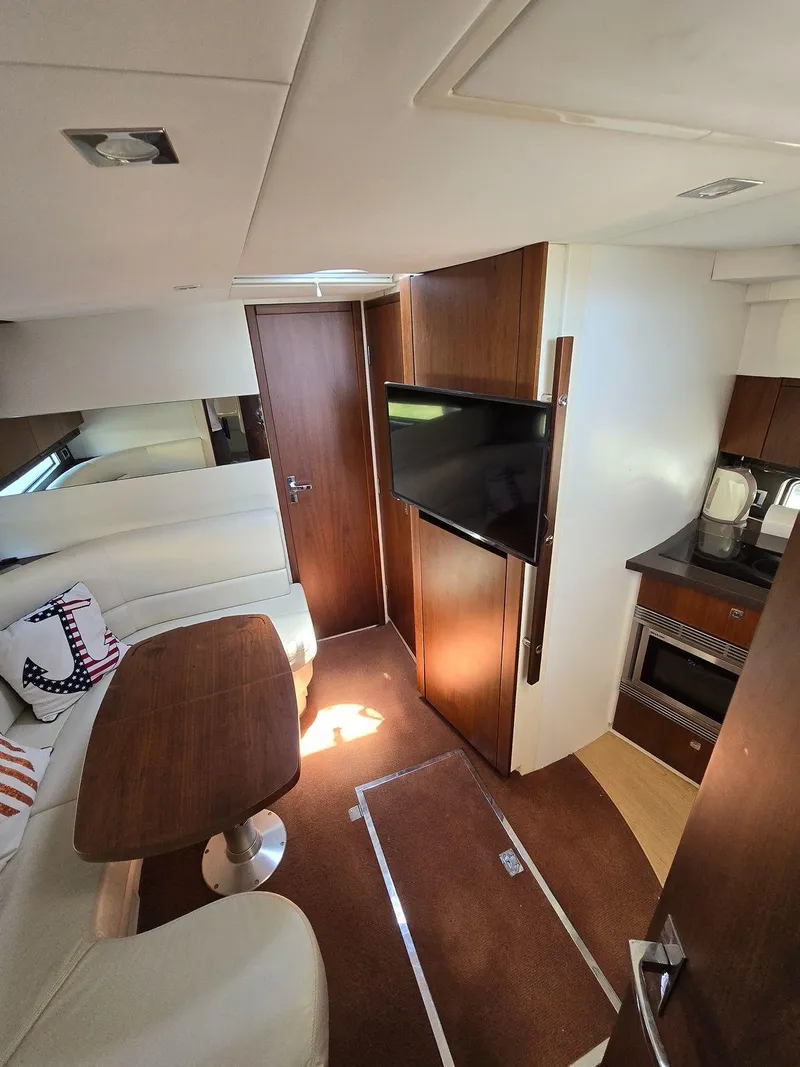 Slide: The Image of Interior of 2013 Fairline Targa 38 Open yacht with modern furnishings and kitchen area. - 22