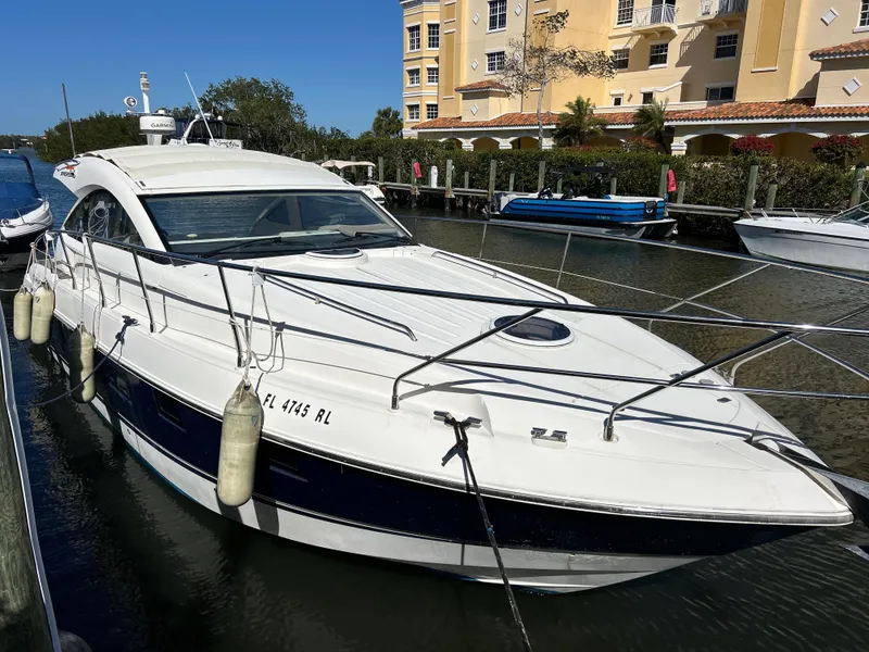 Slide: The Image of 2013 Fairline Targa 38 Open yacht docked near waterfront buildings. - 3