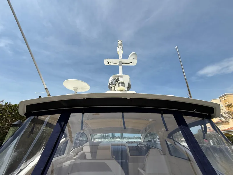 Slide: The Image of 2013 Fairline Targa 38 Open yacht with radar equipment under a clear blue sky. - 33