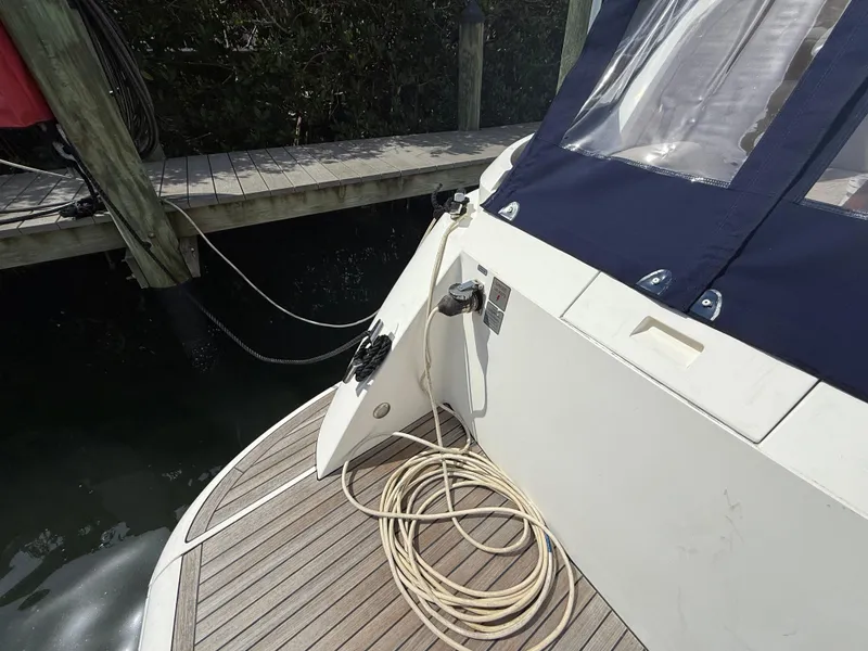 Slide: The Image of 2013 Fairline Targa 38 Open yacht docked, showing deck and mooring line. - 34