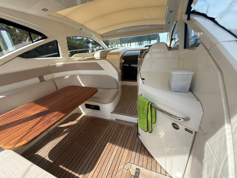 Slide: The Image of 2013 Fairline Targa 38 Open yacht interior with wooden table and seating area. - 37