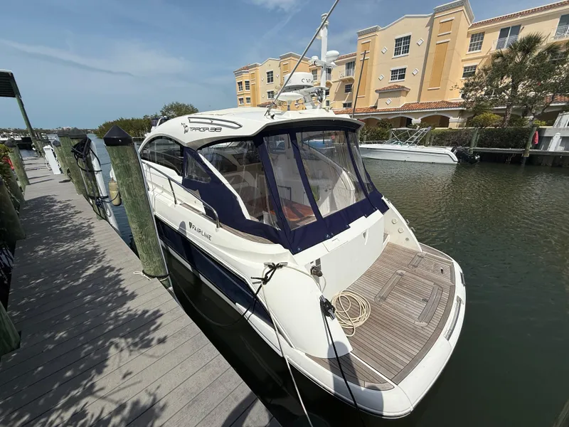 Slide: The Image of 2013 Fairline Targa 38 Open yacht docked at marina, sunny day, waterfront buildings. - 4