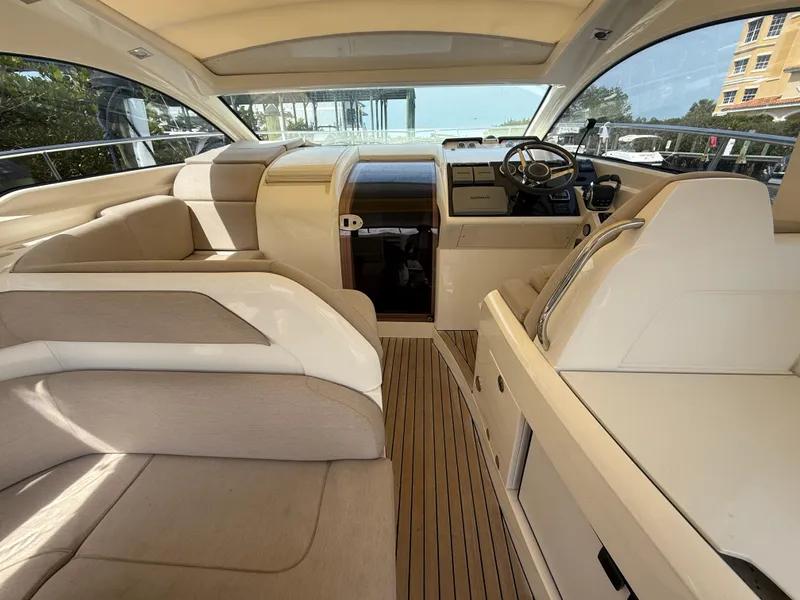 Slide: The Image of Interior of 2013 Fairline Targa 38 Open yacht with beige seating and wooden flooring. - 41