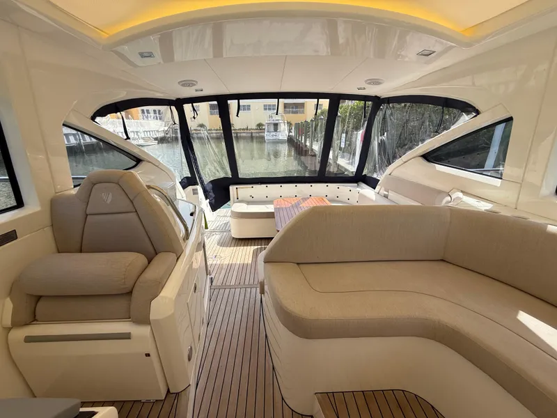 Slide: The Image of Interior of 2013 Fairline Targa 38 Open yacht with beige seating and large windows. - 42