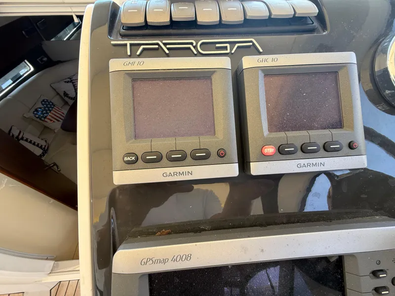 Slide: The Image of Control panel of a 2013 Fairline Targa 38 Open with Garmin navigation displays. - 45