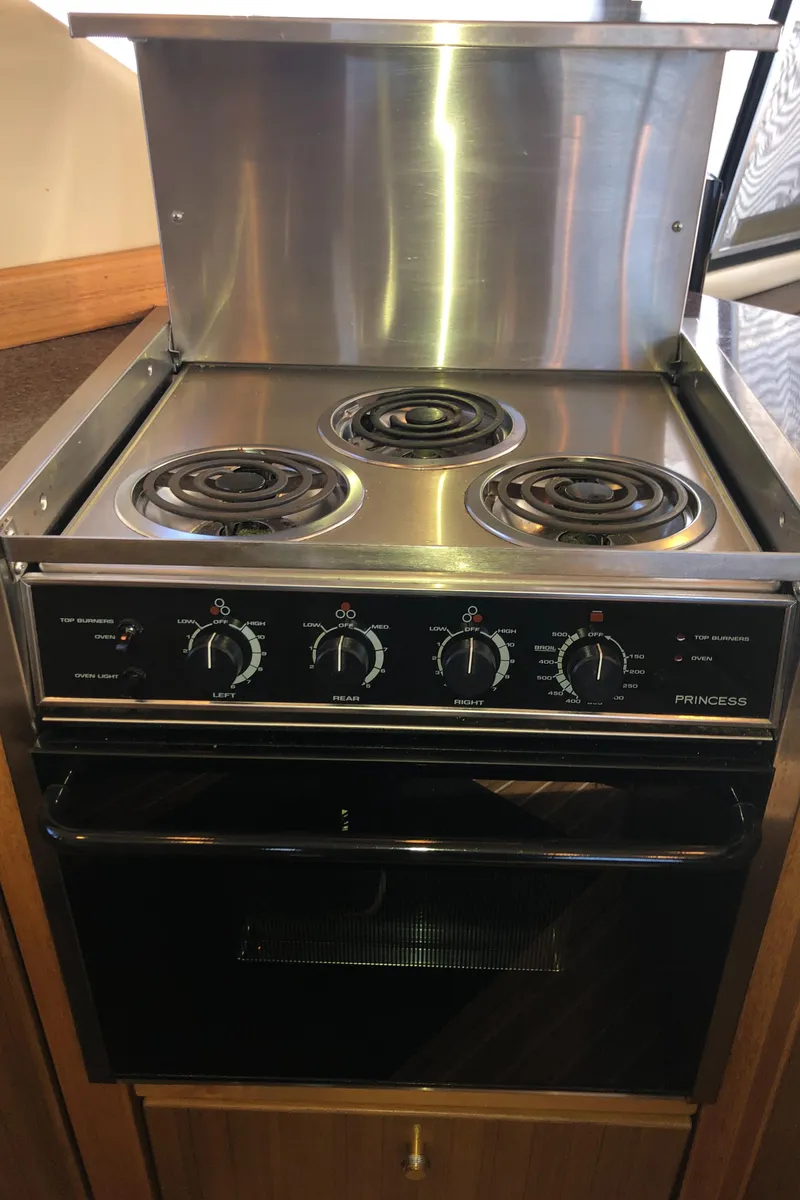 Slide: The Image of Stainless steel stove and oven in 2002 Bayliner 39 Motor Yacht kitchen. - 18