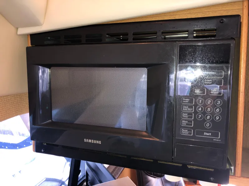 Slide: The Image of Samsung microwave in 2002 Bayliner 39 Motor Yacht kitchen area. - 19