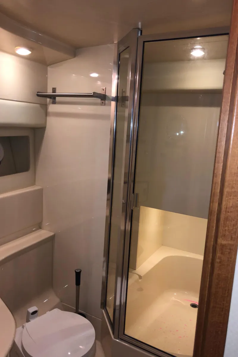 Slide: The Image of 2002 Bayliner 39 Motor Yacht bathroom with shower, toilet, and modern fixtures. - 29