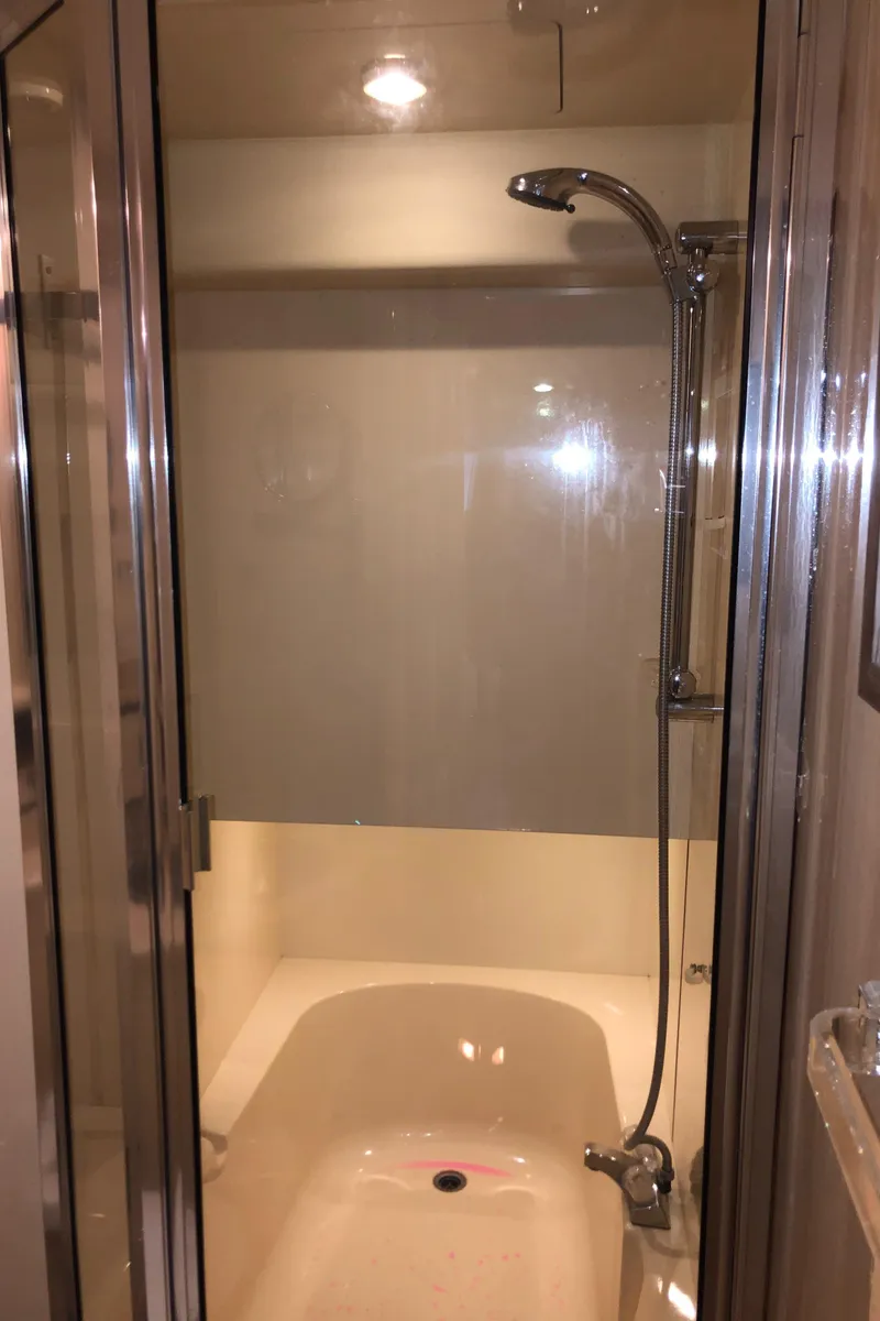 Slide: The Image of Shower area in 2002 Bayliner 39 Motor Yacht with glass door and modern fixtures. - 31