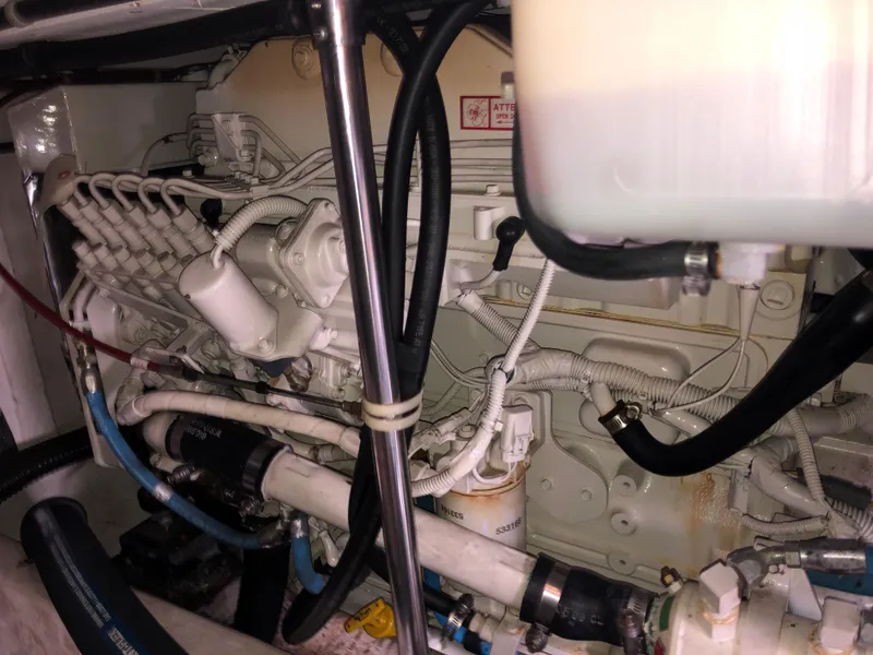 Slide: The Image of Engine room of 2002 Bayliner 39 Motor Yacht, showcasing complex machinery and wiring. - 36