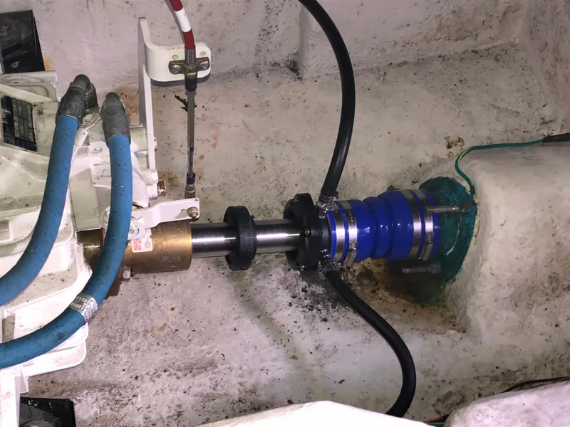 Slide: The Image of Bayliner 39 Motor Yacht 2002 engine compartment with visible shaft and hoses. - 39