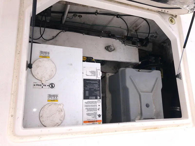 Slide: The Image of 2002 Bayliner 39 Motor Yacht engine compartment with visible components and wiring. - 41