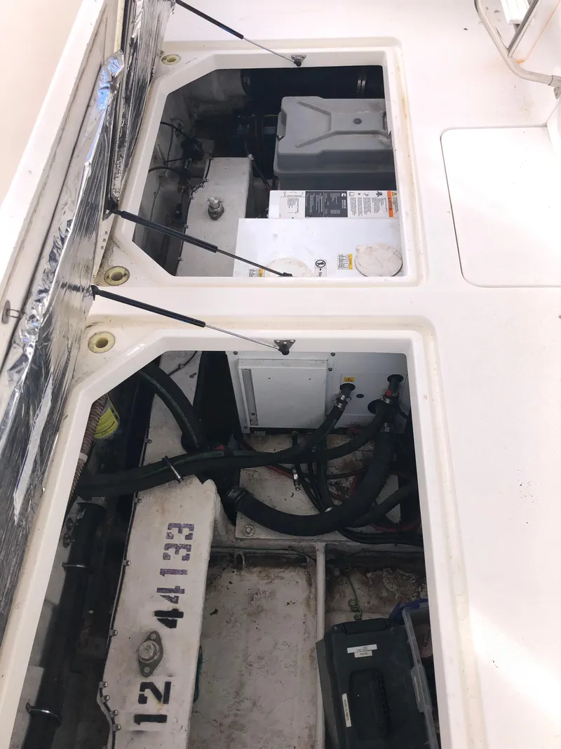 Slide: The Image of Engine compartment of a 2002 Bayliner 39 Motor Yacht, showing mechanical components. - 42