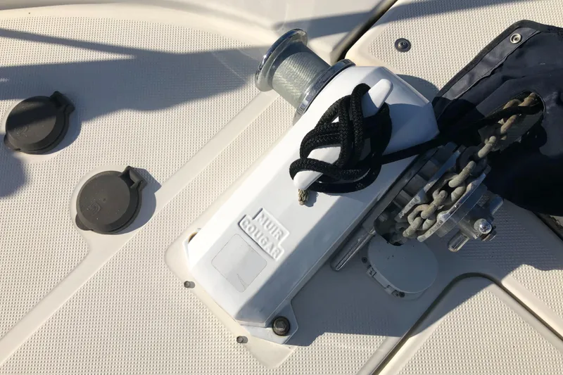 Slide: The Image of Anchor winch on 2002 Bayliner 39 Motor Yacht deck with chain and rope. - 45