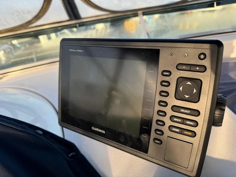 Slide: The Image of Garmin GPS device on 2002 Bayliner 39 Motor Yacht dashboard. - 7